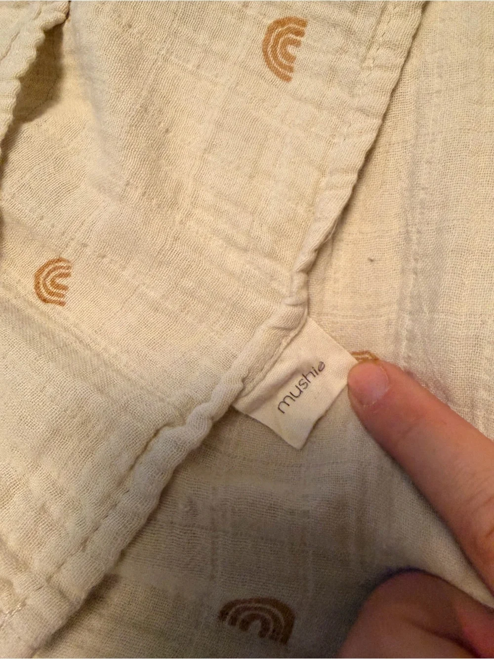 Mushie Neutral Cream Muslin receiving blanket/ swaddle with Tan Rainbow Print